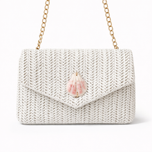 White knitted handbag with a pink flower detail on a white background