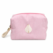 Pink striped pouch with a shell decoration on a white background
