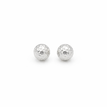 silver golf ball studs on a white background