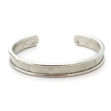 Silver bracelet with engraved design on a white background