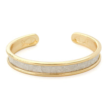 Gold and gray bracelet on a white background