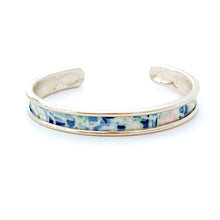 Cuff bracelet with floral pattern on a white background