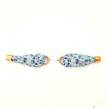 Pair of floral-patterned earrings on a white background
