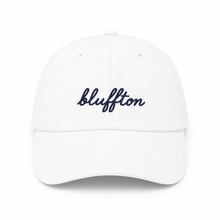 White cap with 'bluffton' embroidered on a white background