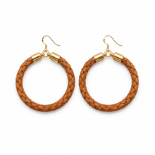 Pair of brown braided hoop earrings with gold accents on a white background