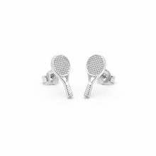 Silver tennis racket-shaped earrings on a white background