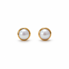 A pair of gold stud earrings with round white freshwater pearls in bezel settings, shown on a clean white background.