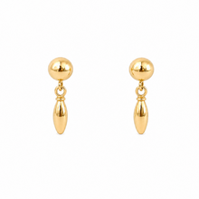 Pair of gold earrings on a white background