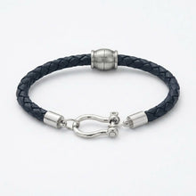Black braided leather bracelet with silver clasp on a white background