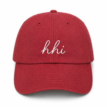 Red cap with 'hhi' text on a white background