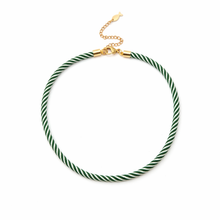 Green and white striped necklace with a gold clasp on a white background