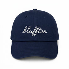 Navy blue cap with 'bluffton' embroidered on a white background