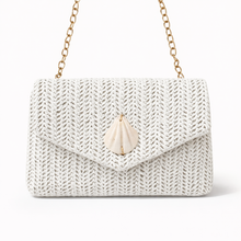 White knit handbag with a gold chain strap on a white background