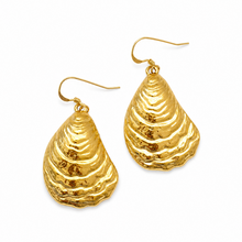Gold teardrop-shaped earrings on a white background