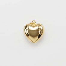 Polished gold-tone puffy heart charm with hanging loop.