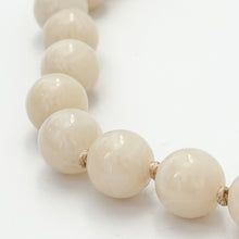 cream acrylic large beaded and knotted necklace