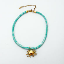 aqua and white stripe rope necklace with crab shell