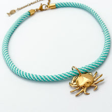 aqua and white stripe rope necklace with crab shell