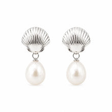 Silver-tone scallop shell studs with oval white pearl drops on white.