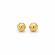 Pair of gold ball earrings on a white background