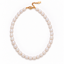 A strand of irregular white freshwater pearls arranged in an oval shape with a gold clasp and extender chain, photographed on a clean white background.
