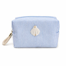Blue and white striped pouch with a shell decoration on a white background