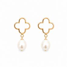 Gold quatrefoil earrings with pearl drops on a white background