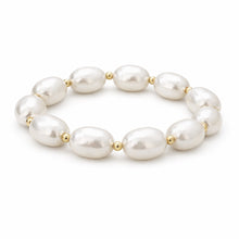 Pearl bracelet with gold beads on a white background
