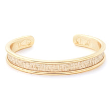 Gold bracelet with woven pattern on a white background
