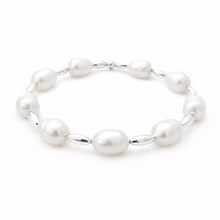Pearl bracelet with silver links on a white background