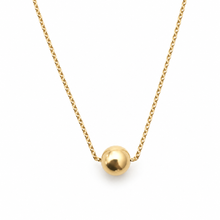 A delicate gold chain necklace featuring a polished, spherical gold pendant, displayed against a clean white background.