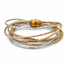 A multi-strand wrap bracelet featuring textured gold and silver-tone metal bands, secured with a polished gold cylindrical clasp, shown on a clean white background.