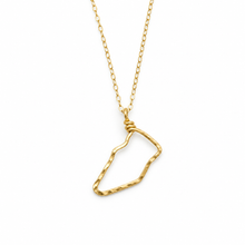 A gold chain necklace with a textured, open geometric outline pendant, shown against a plain white background. Hilton head island hand hammered necklace