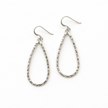 Pair of silver teardrop earrings on a white background