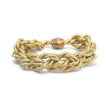 Gold braided bracelet on a white background