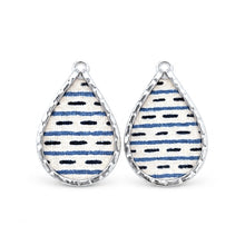 Small broad teardrop pieces with navy broken stripes and silver-tone rims.