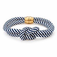 A double-strand rope bracelet with a knotted center and a polished gold clasp, shown on a clean white background.