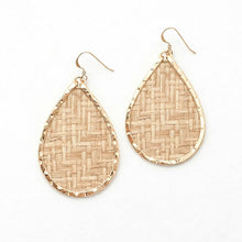 Teardrop-shaped earrings with woven pattern and gold frame on a white background