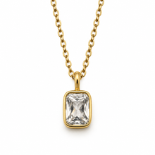 A gold chain necklace with a rectangular clear gemstone pendant in a gold bezel setting, shown against a plain white background.