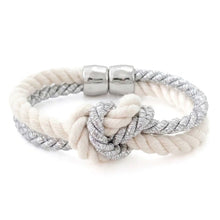 Bracelet with white rope design and silver metal elements on a white background