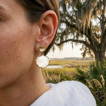 Model wearing a white scallop drop earring with gold-tone round post.