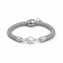 Silver bracelet with a pearl bead on a white background