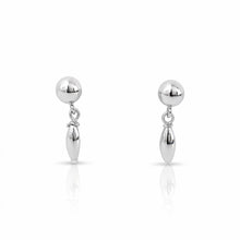 Pair of silver ball earrings on a white background