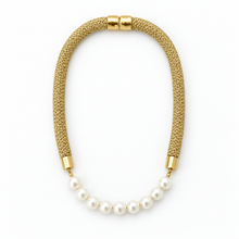A gold-toned mesh necklace with a curved section of white freshwater pearls, finished with gold end caps, shown on a plain white background.