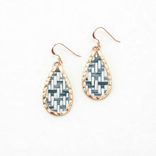 Teardrop-shaped earrings with woven pattern and rose gold frame on white background