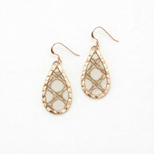 Teardrop-shaped earrings with rose gold frames on a white background