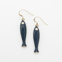 Navy fish-shaped earrings with gold hooks on a white background