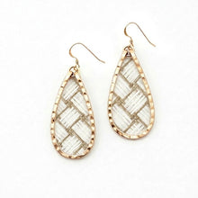 Teardrop-shaped earrings with gold frame and textured design on a white background