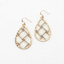 Teardrop-shaped earrings with gold and clear stone design on a white background