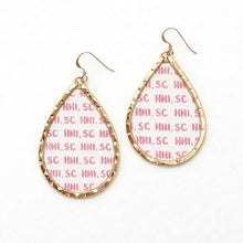 Gold hoop earrings with pink text pattern on a white background HHI, SC
